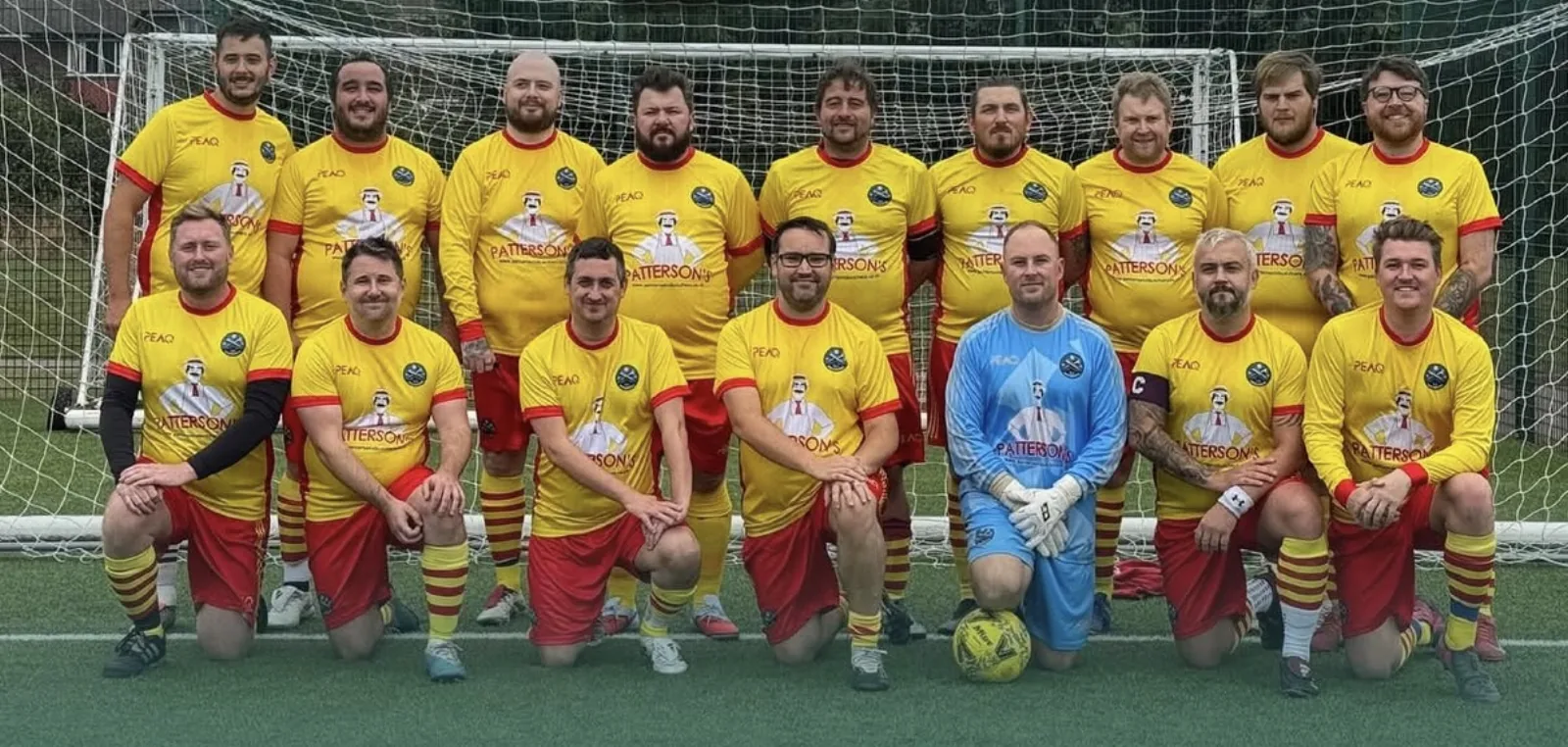 Squad photo of Patterson's FC in custom Peaq kit.